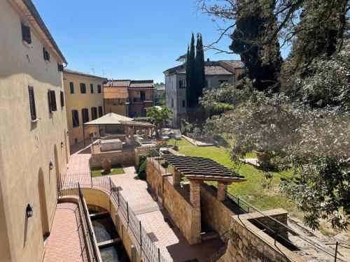 a view of a city with a bridge and buildings at Villa Borri in Casciana Terme
