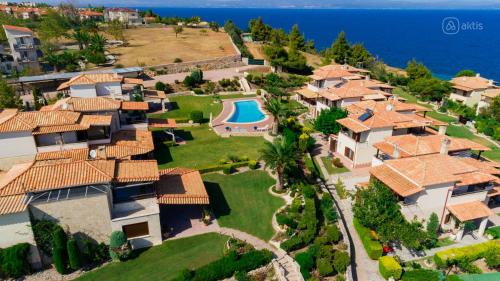 an aerial view of a house with a swimming pool at Porto Thea Villa in Afytos in Afitos