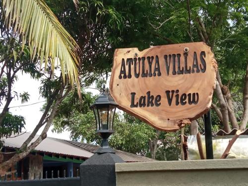a sign for aixka villas lake view at Atulya Lake View Mirissa - Resort and Spa in Mirissa