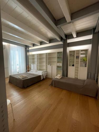 A bed or beds in a room at Casa Giulietta - ombrellone e 2 lettini inclusi