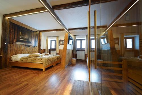 Postel nebo postele na pokoji v ubytování Hotel lo Stambecco