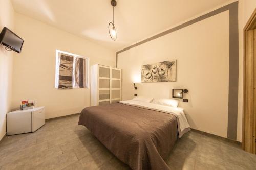 a bedroom with a large bed in a room at L'Aurora in Ceraso