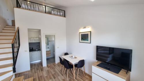 Televisyen dan/atau pusat hiburan di Apartment Olive