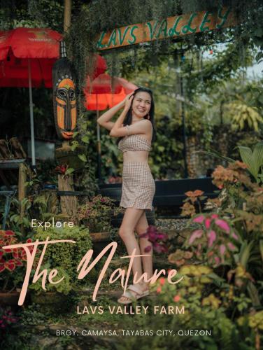 a woman in a dress standing in a garden at Lavs Valley in Dapdap