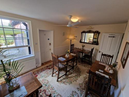 a living room with a table and a dining room at Canterbury Black Horse Inn in Canterbury