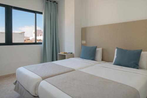 Ένα ή περισσότερα κρεβάτια σε δωμάτιο στο Sabbia Suites Arrecifeando