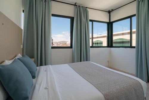 Posteľ alebo postele v izbe v ubytovaní Sabbia Suites Arrecifeando