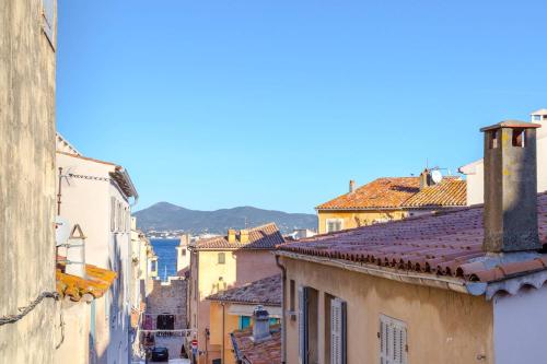 a view of the city from the roofs of buildings at Le Yaca Saint-Tropez in Saint-Tropez