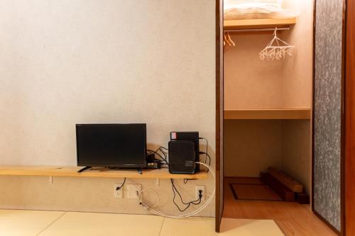 a desk with a computer monitor on top of it at 和縁WAEN SKYTREE in Tokyo