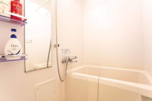 a shower in a bathroom with a bath tub at 和縁WAEN SKYTREE in Tokyo