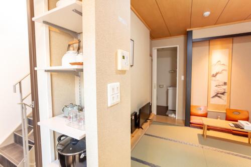 two views of a room with a hallway at 和縁WAEN SKYTREE in Tokyo