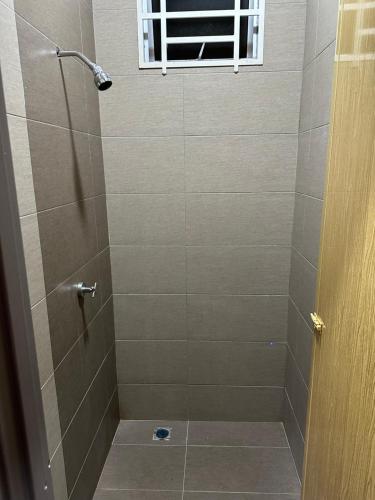 a bathroom with a shower with a glass door at Cassa Vistana Homestay Alor - Langgar near HSB in Alor Setar