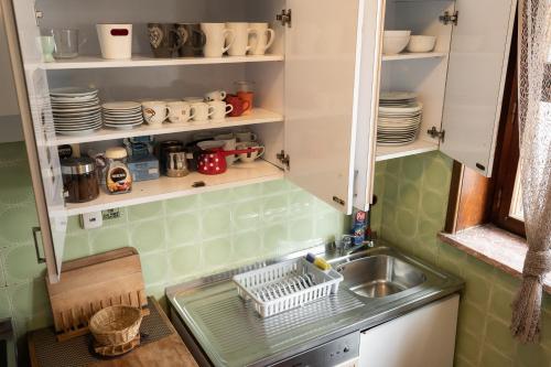 a small kitchen with a sink and a counter top at Pi House in Ljubljana