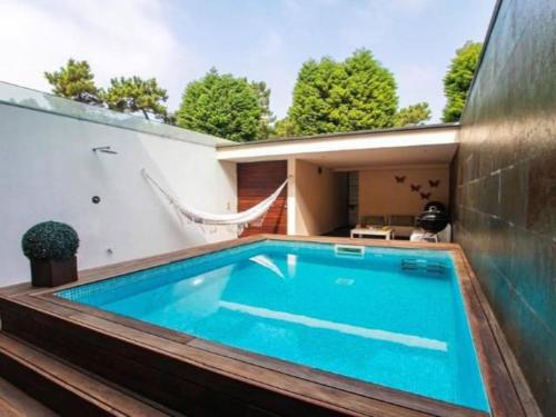 a swimming pool in the backyard of a house at Quinta da Barca House - Nada melhor que juntar Luxo a Lazer com mar e rio! in Esposende