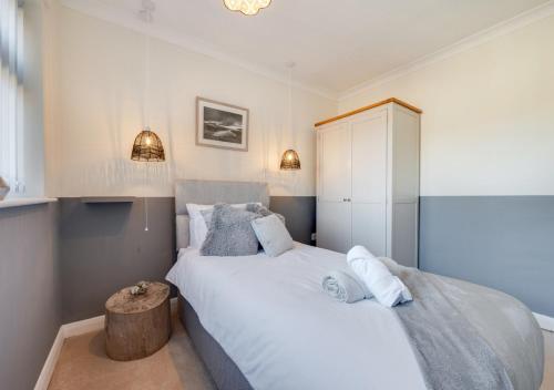 a bedroom with two beds and a table at Brigantine in Martham