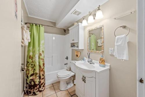a bathroom with a sink and a toilet and a shower at Great Location 1BR Pool Parking Pets Allowed 5 in Myrtle Beach