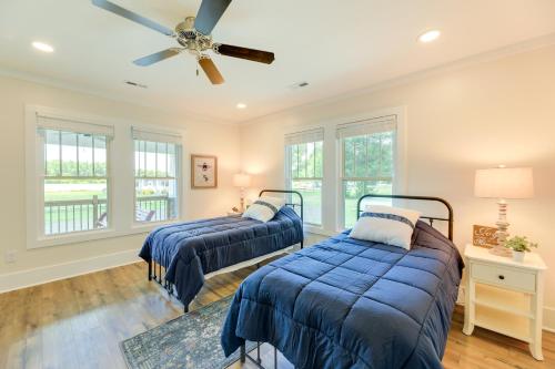 a bedroom with two beds and a ceiling fan at New Bern Vacation Rental on Farm with Fire Pit! in New Bern