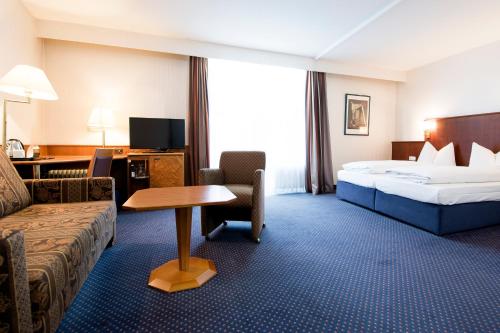 Postel nebo postele na pokoji v ubytování domus Hotel