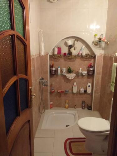 a bathroom with a bath tub and a toilet at Borj2 in Essaouira