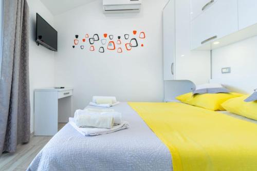 Katil atau katil-katil dalam bilik di Apartman Mimi