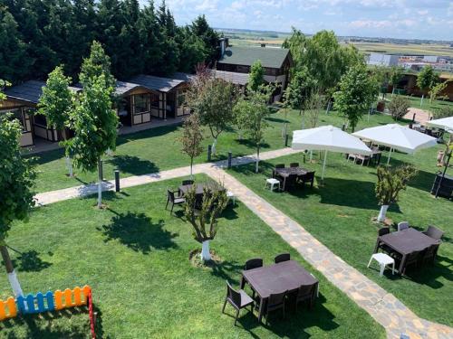 an overhead view of a park with tables and umbrellas at Hotel Bon Garden City in Silivri