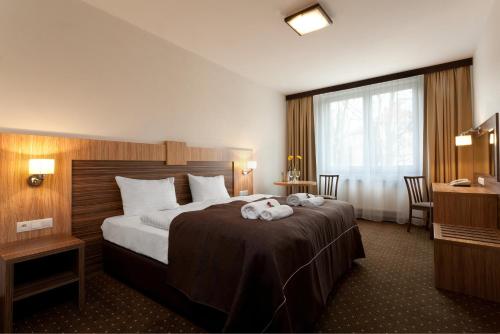 Llit o llits en una habitació de Hotel Milenium