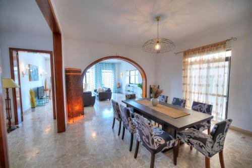 a dining room with a table and chairs at Enormous 3bedrooms seafront with balcony PDEH1-1 in Sliema