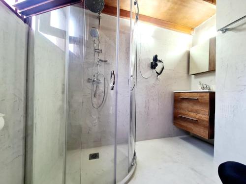 a shower in a bathroom with a glass shower stall at Cosmos Old Town in Rhodes Town