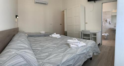 Ένα ή περισσότερα κρεβάτια σε δωμάτιο στο Hotel Laika
