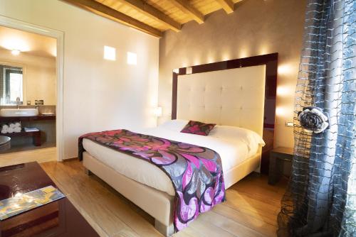 Postel nebo postele na pokoji v ubytování Il Borgo - 1711 Luxury Guest House