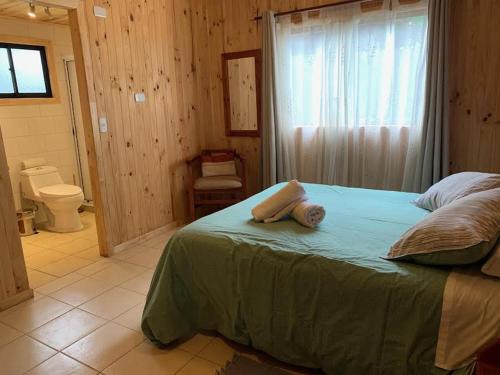 Cabañas Huelquehueにあるベッド
