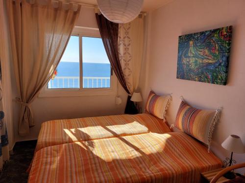 En eller flere senge i et værelse på Casa Miramar Santa Pola