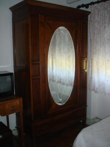 Кровать или кровати в номере Pensão Residencial Luanda