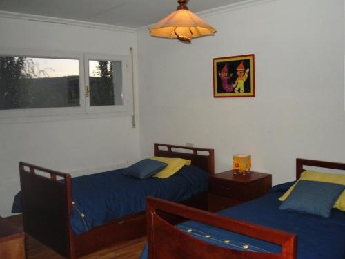 Ένα ή περισσότερα κρεβάτια σε δωμάτιο στο casa chalet El Sotillo