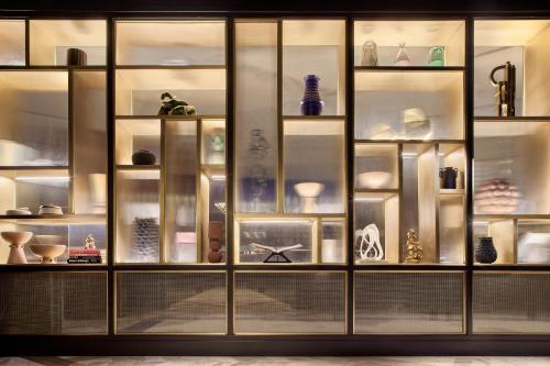 a large glass display case with various items on it at The Ritz-Carlton, Mexico City in Mexico City