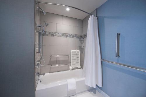 a bathroom with a shower with a shower curtain at Residence Inn Atlanta Perimeter Center Dunwoody in Atlanta