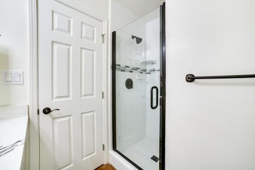 a shower with a glass door in a bathroom at Salinas Home with Pool - Near WeatherTech Raceway! in Salinas