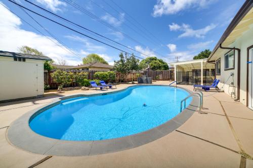 a swimming pool in the backyard of a house at Salinas Home with Pool - Near WeatherTech Raceway! in Salinas
