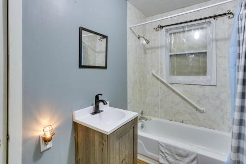 a bathroom with a sink and a bath tub and a sink at Vacation Rental Near Hoosier National Forest! in Taswell