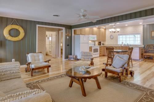 a living room with a couch and a table at Waterfront Annapolis Home Fire Pit and Fishing Pier in Annapolis