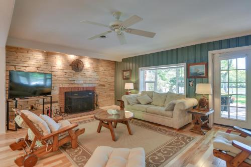a living room with a couch and a fireplace at Waterfront Annapolis Home Fire Pit and Fishing Pier in Annapolis