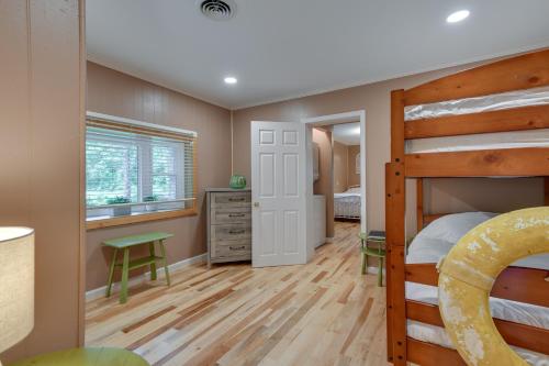 a bedroom with a bunk bed and a desk at Waterfront Annapolis Home Fire Pit and Fishing Pier in Annapolis