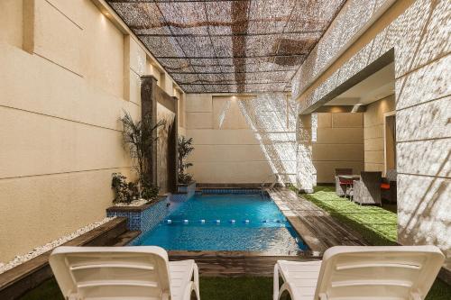 a swimming pool in the middle of a building at M Residence New Cairo - Families only in Cairo
