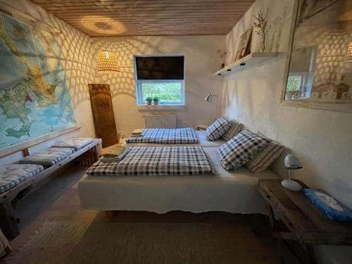 a bedroom with two beds in a room at Anita's B & B in Jelling