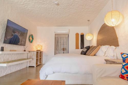Postel nebo postele na pokoji v ubytování Bora Bora Beach Club & Hotel
