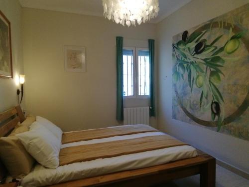 Posteľ alebo postele v izbe v ubytovaní Guest House El Angelito de Olivas
