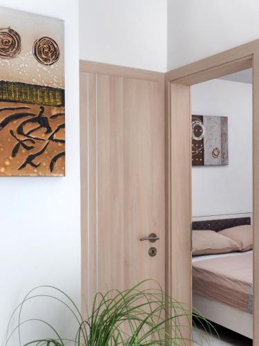 a room with a door leading to a bedroom at Villa Sirenis in Trogir