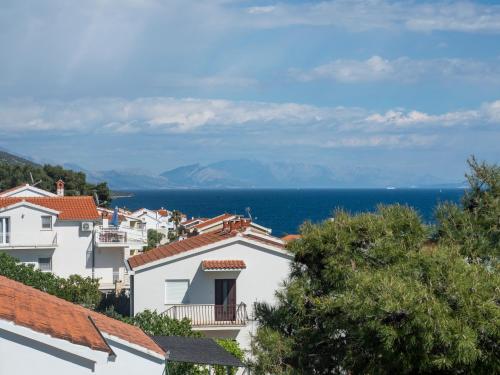 a view of the ocean from the roofs of houses at Villa Sirenis in Trogir