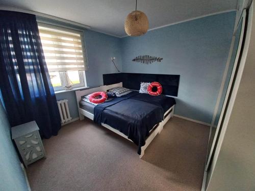 Postel nebo postele na pokoji v ubytování Apartament Gruba Ryba