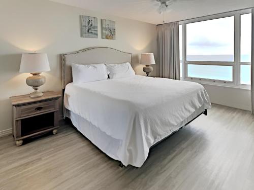 Voodi või voodid majutusasutuse Hidden Dunes Gulfside #A805 toas